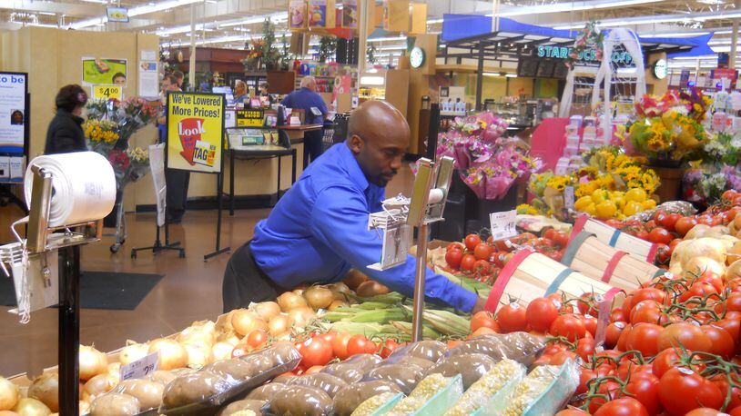 A produce manager at Kroger at work. FILE