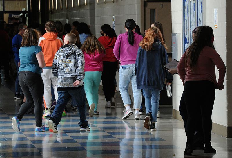 Students at Miamisburg Middle School walk through the hallways on May 5. Miamisburg is one of the schools in the region who have added mental health staff and are working to support students and teachers after a difficult two years.  School and hospital officials are concerned about teen's mental health across the Miami Valley.  Marshall Gorby  Staff 