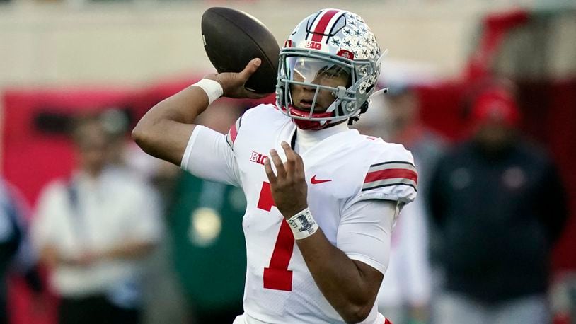 Ohio State quarterback C.J. Stroud throws during the first half of an NCAA college football game against Michigan State, Saturday, Oct. 8, 2022, in East Lansing, Mich. (AP Photo/Carlos Osorio)