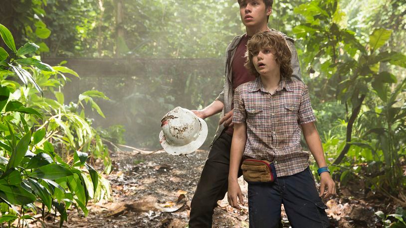 This photo provided by Universal Pictures shows, Nick Robinson, left, and Ty Simpkins in a scene from the film, "Jurassic World," directed by Colin Trevorrow, in the next installment of Steven Spielberg's groundbreaking "Jurassic Park" series. The 3D movie releases in theaters by Universal Pictures on June 12, 2015. (Chuck Zlotnick/Universal Pictures via AP)