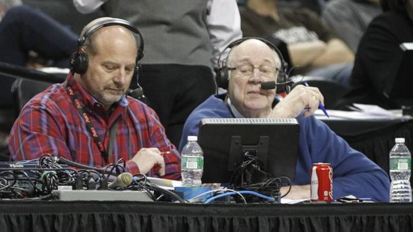 WHIO's Larry Hansgen, left, and Bucky Bockhorn broadcast the Flyers' victory over Fordham in the second round of the A-10 tournament on Thursday, March 13, 2014, at the Barclays Center in Brooklyn, N.Y.