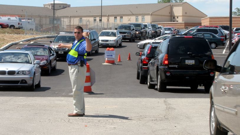 DriveOhio, the University of Cincinnati and the Unmanned Aircraft Systems Group (UAS) from Springfield are coming to Springboro to study traffic problems during peak traffic along the stretch of South Main Street in front of five local schools. Pictured is George Long, former business manager for Springboro schools, directing traffic at the high school after the first day of classes in 2005.