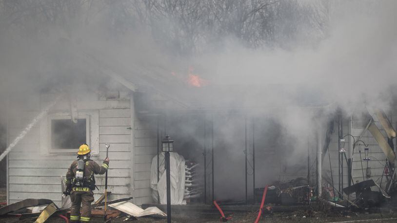 Firefighters from Dayton, Jefferson Twp., Germantown, Trotwood and Farmersville battled a house fire on Dayton Liberty Road Thursday Jan. 28, 2021. One person suffered third-degree burns and was taken to Miami Valley Hospital. JIM NOELKER/STAFF