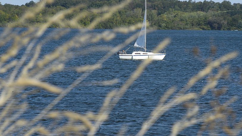 A sailboat owner takes advantage of a breezy day to sail around C.J. Brown Reservoir. Staff photo by Bill Lackey