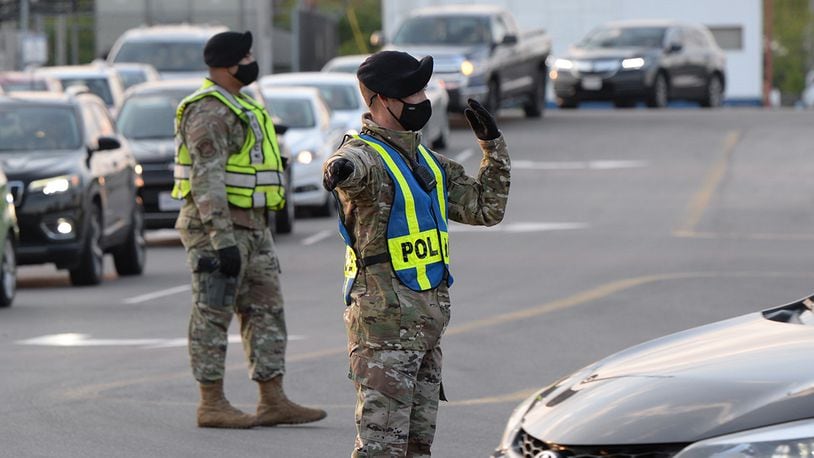 Personnel from the 88th Security Forces Squadron direct traffic entering Gate 12A at Wright-Patterson Air Force Base. U.S. AIR FORCE PHOTO/TY GREENLEES