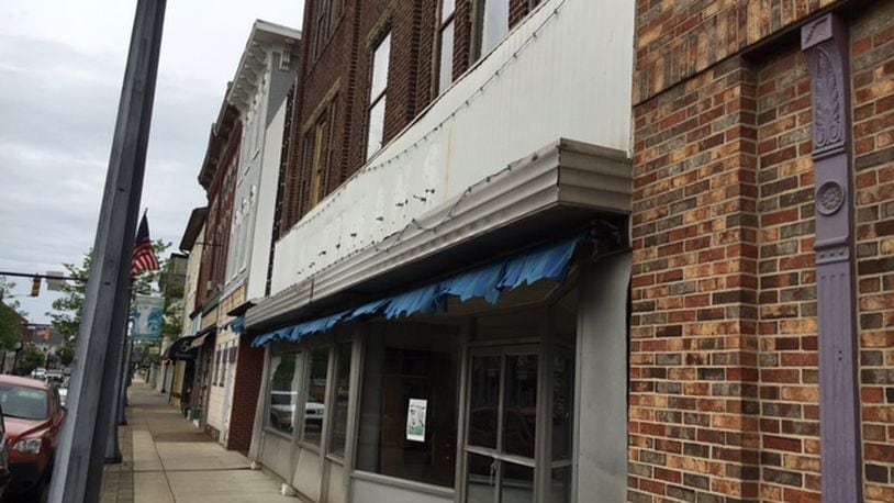 The former Suttman’s site at 24-32 S. Main St. in downtown Miamisburg includes three properties totalling more than 17,500 square foot of space targeted for new retail and housing. NICK BLIZZARD/STAFF