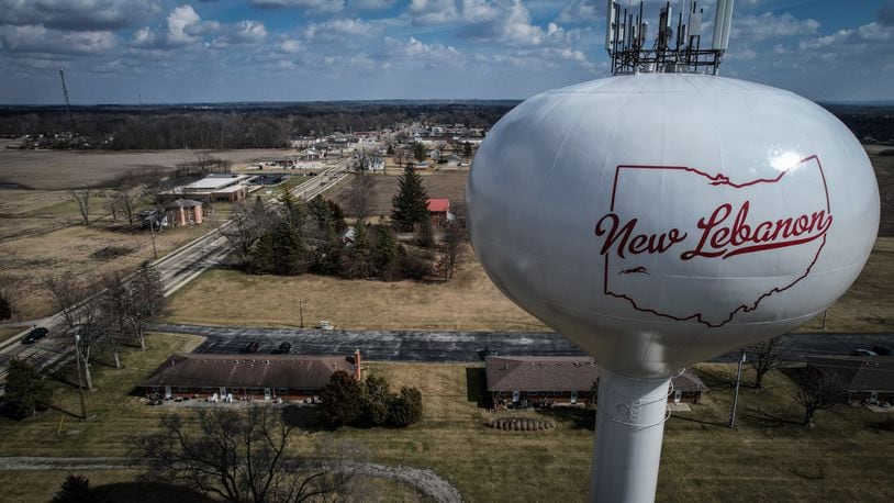 The water tower stands on the west side of the village of New Lebanon Ohio. The village council recently put 5 village leaders on leave. Jim Noelker/Staff