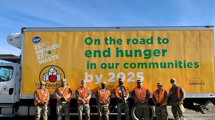 National Air and Space Intelligence Center volunteers are pictured in front of The Foodbank truck Nov. 23. The Airmen spent hours unloading, organizing and distributing Thanksgiving food for local families. CONTRIBUTED PHOTO