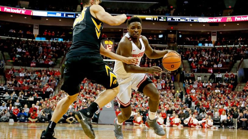 COLUMBUS, OH - FEBRUARY 10:  Jae'Sean Tate #1 of the Ohio State Buckeyes drives against Luka Garza #55 of the Iowa Hawkeyes during the first half of the game at Value City Arena on February 10, 2018 in Columbus, Ohio. (Photo by Kirk Irwin/Getty Images)