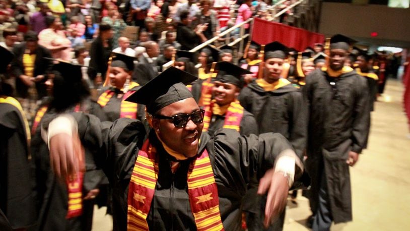 Central State graduates celebrate at a past commencement ceremony. STAFF FILE PHOTO