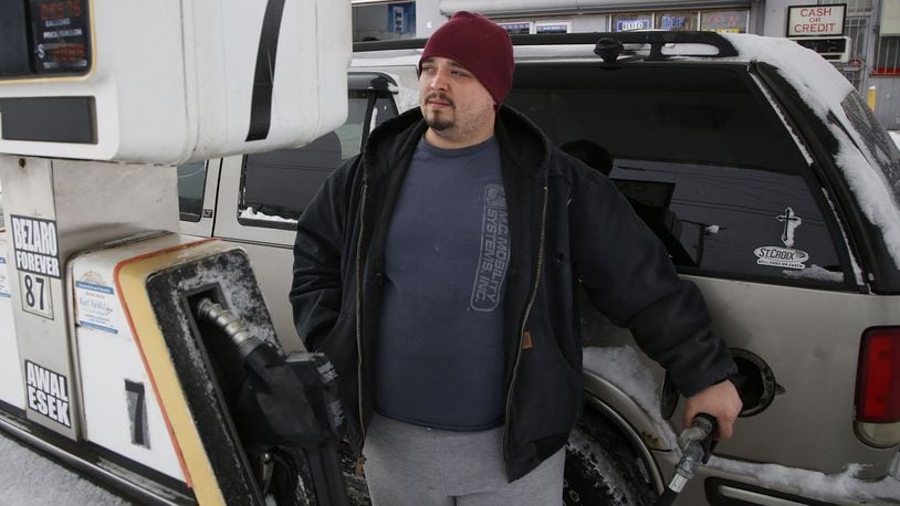 Dayton resident Alex Smith, 26, doesn’t like the idea of more taxes on gasoline, but added, “Maybe they’ll fix some of these roads and bridges.” TY GREENLEES / STAFF