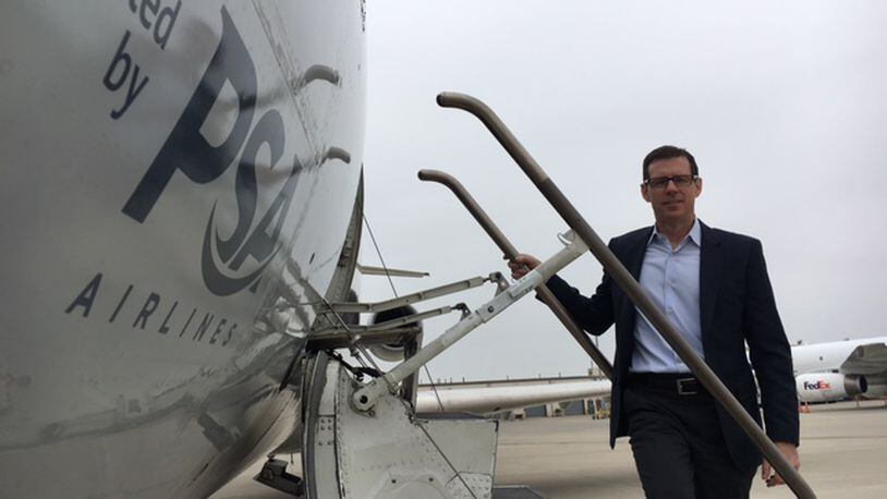 PSA Airlines President Dion Flannery, on the steps of a Bombardier CRJ aircraft.