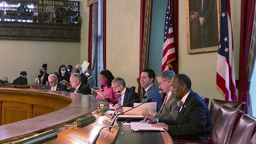 Members of the Ohio Redistricting Commission – from left, Senate President Matt Huffman, Auditor Keith Faber, House Minority Leader Emilia Sykes, Gov. Mike DeWine, Secretary of State Frank LaRose, House Speaker Bob Cupp and Sen. Vernon Sykes – pictured at the Ohio Statehouse in Columbus, Ohio, during their first meeting on Aug. 6, 2021. (AP Photo/Julie Carr Smyth)