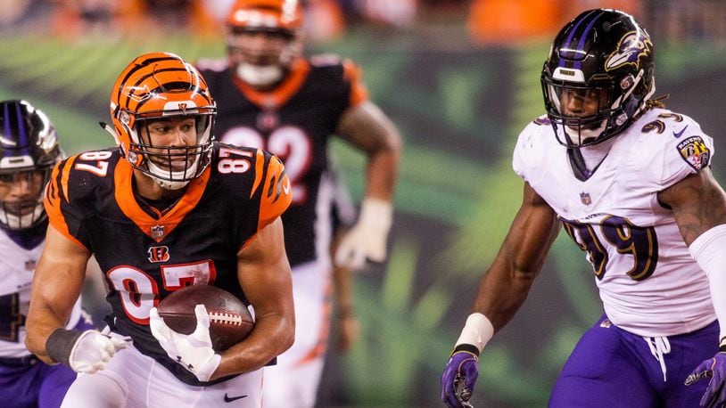 Cincinnati Bengals C.J. Uzomah carries the bal lafter making a catch during their game against the Baltimore Ravens Thursday, Sept. 13 at Paul Brown Stadium in Cincinnati. The Cincinnati Bengals defeated the Baltimore Ravens 34-23. NICK GRAHAM/STAFF