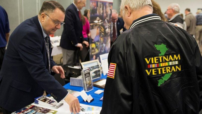 Art Powell, a volunteer with the National Museum of the U.S. Air Force, talked with a retiree and veteran about what the museum has to offer and potential volunteer opportunities during the Wright-Patterson Air Force Base Retiree Appreciation day in 2017.  (U.S. Air Force photo/Wesley Farnsworth)