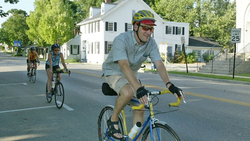 In this file photo a bike rider led a group of riders down Main Street in Springboro The latest Census data shows Springboro saw a 1.4 percent increase in population between 2015 and 2016.