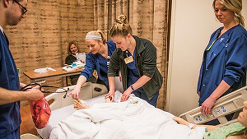 Nursing students work in a nursing lab at Kettering College earlier this year. From left, Ian Valentine, Kari Cox, Alyssa Adams, Danielle Engle and instructor Kathleen Volt. CONTRIBUTED