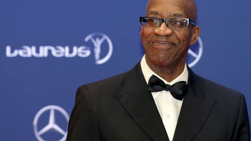 FILE - In this April 18, 2016, file photo, Edwin Moses poses for photos as he arrives for the Laureus World Sports Awards in Berlin, Germany.  (AP Photo/Markus Schreiber, File)
