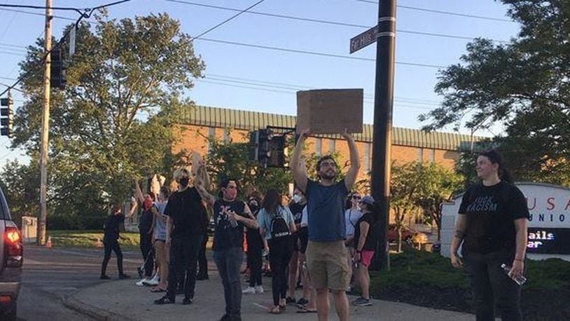 A group of protesters were in front of Mid USA Credit Union Tuesday night, June 2, 2020, at the corner of Far Hills Avenue and Dorothy Lane in Kettering. The group marched down Far Hills Avenue in Oakwood to the intersection. JEN BALDUF / STAFF