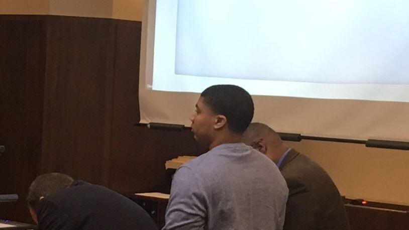 Kylen Gregory of Kettering is flanked by his attorneys Tuesday during the first day of testimony in his murder trial for the death of Ronnie Bowers. Bowers died after being shot in the back of the head on Sept. 4, 2016 in Kettering.