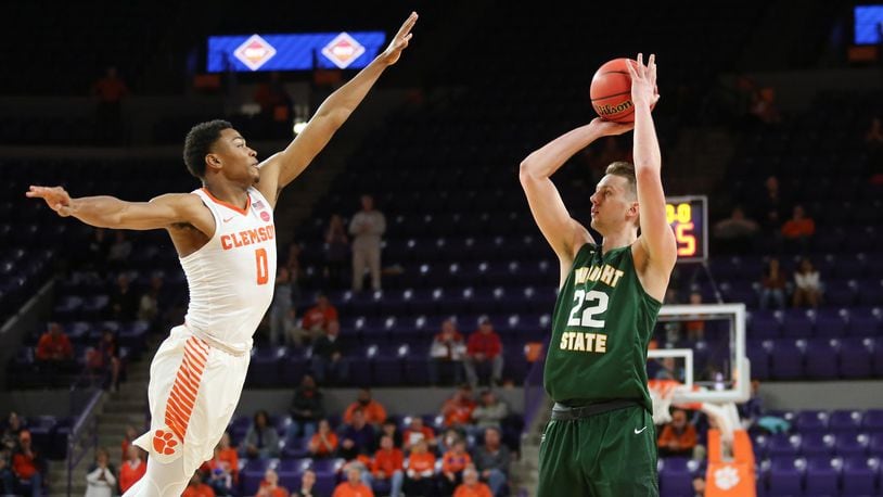 Wright State’s Parker Ernsthausen (22) tries to get a shot over Clemson’s Clyde Trapp (0) during Tuesday night’s NIT game at Littlejohn Coliseum in Clemson, S.C. Clemson won 75-69. PHOTO COURTESY OF CLEMSON ATHLETICS