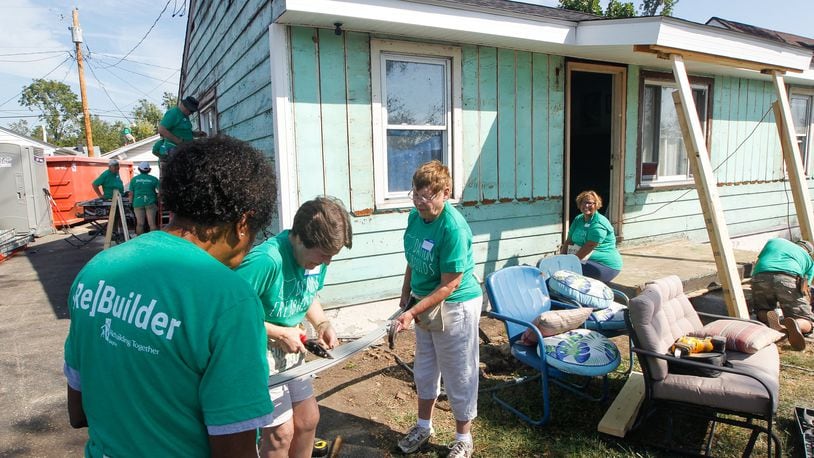 Volunteers from Shiloh Church work Thursday, Sept. 19, 2019, to help Jessica Brady’s house in Harrison Twp. The rebuilding project is the first tornado-damaged home to be repaired through a partnership of non-profit organizations formed following the Memorial Day natural disaster. CHRIS STEWART / STAFF
