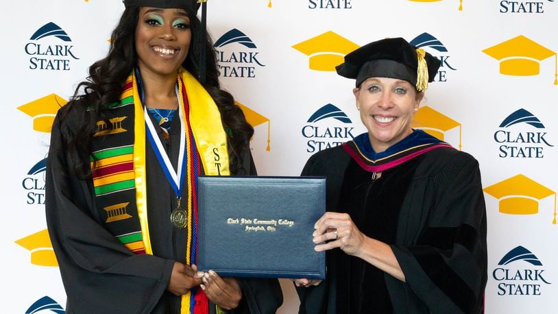 Anarra Williams, a 2020 Clark State Community College graduate, receives her diploma from Clark State Community College President Dr. Jo Alice Blondin. Photo by Laurie Means