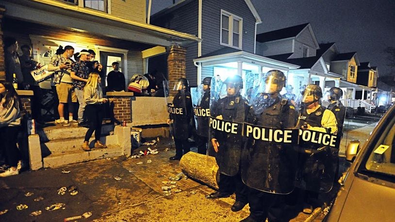 The University of Dayton Police and city of Dayton Police dispersed a large crowd of “disorderly” students Wednesday morning during a street party where about 1,000 students gathered. Authorities say students threw bottles and damaged vehicles during the incident. MARSHALL GORBY/ STAFF