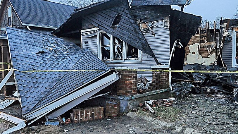 A George Street home in Dayton exploded after a man attempted to relight the furnace's pilot light. STAFF PHOTO / MARSHALL GORBY