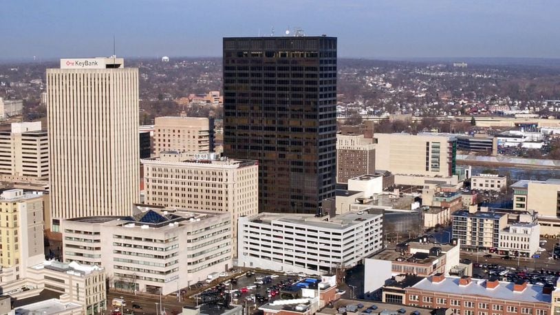 Stratacache’s real estate acquisition arm, Arkham Ventures, bought Kettering Tower, center, downtown’s tallest building, for $13 million. That announcement came less than two months after the company also bought the Courthouse Plaza tower at 10 N. Ludlow St. for nearly $1.7 million. TY GREENLEES / STAFF