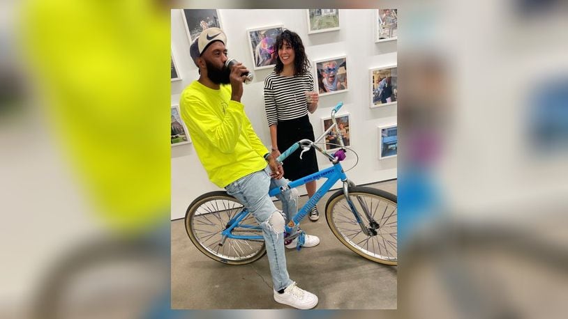 Amy Lynn Powell, right, with Boof (Brandon Smith) who is in the show and brought members of his DaytonBikeMeet group to see the exhibit. CONTRIBUTED