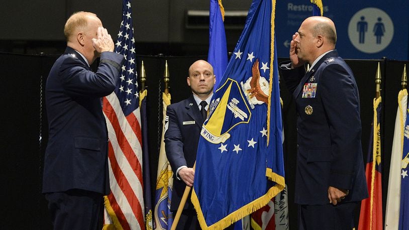 Col. Patrick Miller assumes command of the 88th Air Base Wing from Lt. Gen. Robert McMurry, Air Force Life Cycle Management Center commander, during a change of command ceremony inside the National Museum of the United States Air Force at Wright-Patterson Air Force Base June 12. Miller replaced Col. Thomas Sherman. This year’s change of command ceremony was different from years past with no more than 50 people in attendance but instead broadcast live over social media and no contact between principles due to the COVID-19 pandemic. (U.S. Air Force photo/Wesley Farnsworth)