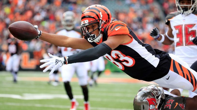 CINCINNATI, OH - OCTOBER 28: Tyler Boyd #83 of the Cincinnati Bengals dives over Isaiah Johnson #39 of the Tampa Bay Buccaneers in an attempt to reach the end zone during the first quarter at Paul Brown Stadium on October 28, 2018 in Cincinnati, Ohio. Boyd was knocked out of bounds just short of the goal line. (Photo by Andy Lyons/Getty Images)