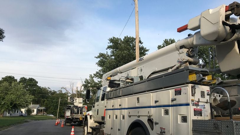 DP&L trucks were parked on Fruedenberger Ave. on the west side of Dayton as crews worked to restore power. Storms on Tuesday and Thursday knocked out service to tens of thousands of customers. Most has been restored, but a few patches of outages remained Thursday evening. GRANT PEPPER/STAFF