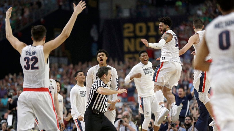 Gonzaga players celebrate after the semifinals of the Final Four NCAA college basketball tournament against South Carolina, Saturday, April 1, 2017, in Glendale, Ariz. Gonzaga won 77-73. (AP Photo/David J. Phillip)