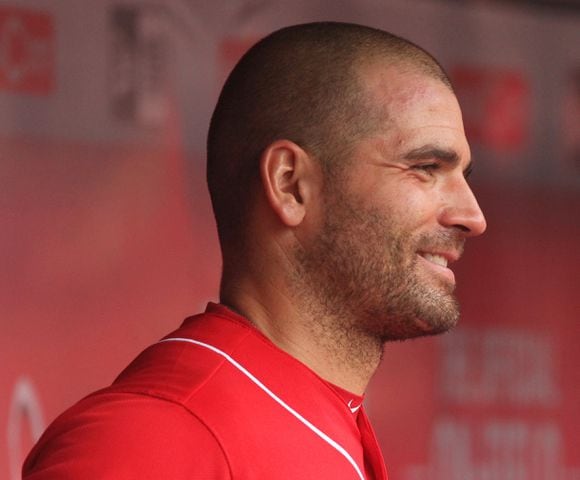 Reds first baseman Joey Votto smiles in the dugout during a game against the Rockies on Sunday, May 21, 2017, at Great American Ball Park in Cincinnati. David Jablonski/Staff