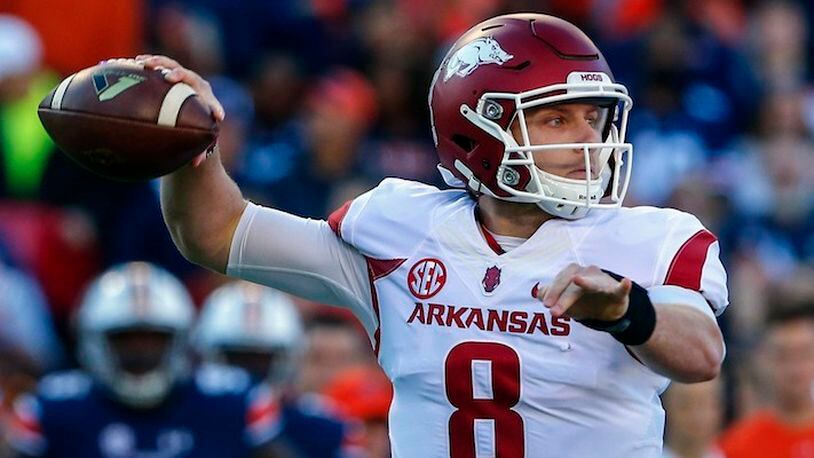 In this Oct. 22, 2016, file photo, Arkansas quarterback Austin Allen (8) throws a pass against Auburn during the first half of an NCAA college football game, in Auburn, Ala. After a successful first season as the starting quarterback at Arkansas for Austin Allen, the senior enters this season with a resume equal to nearly any other signal caller in the country. Both he and Razorbacks coach Bret Bielema know, however, that the national recognition isn't likely to come until Arkansas starts winning more games. (AP Photo/Butch Dill, File)