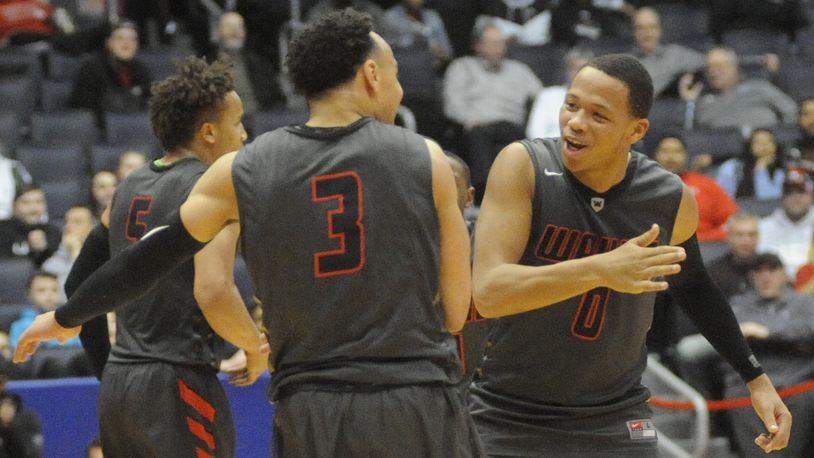 Darius Quisenberry (left) and Rashad McKee of Wayne during a district final defeat of Oak Hills at UD Arena on Saturday. MARC PENDLETON / STAFF