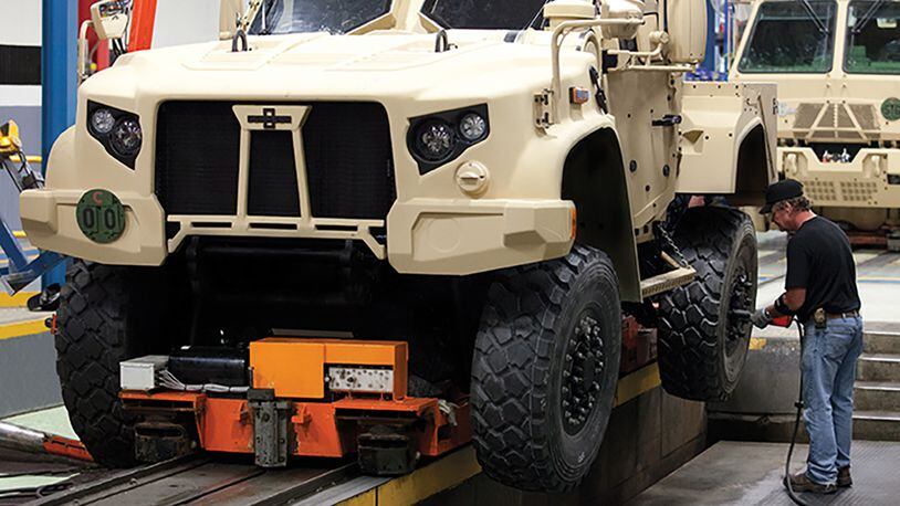 A Joint Light Tactical Vehicle moves on a production line. The new vehicle will begin replacing up-armored High Mobility Multipurpose Wheeled Vehicles, better known as Humvees in 2021. U.S. AIR FORCE PHOTO