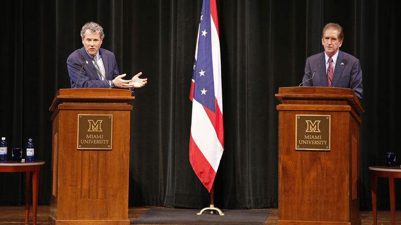 Sen. Sherrod Brown, D-Ohio, left, answers a question as Rep. Jim Renacci, R-Ohio, listens during the U.S. Senate debate at held at Miami University Friday, Oct. 26, 2018, in Oxford, Ohio. (AP Photo/Gary Landers)