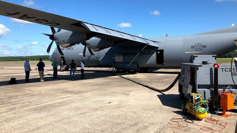A C-130 is prepped for simulant dissemination, after which the aircraft will be taxied and then flown to measure the rate at which the simulant leaves the aircraft. CONTRIBUTED PHOTO