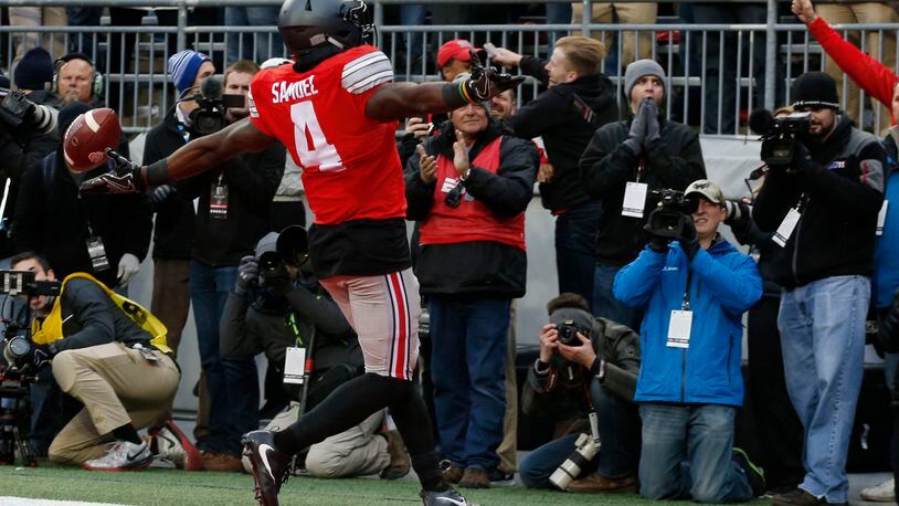 Ohio State running back Curtis Samuel celebrates his touchdown against Michigan during the second overtime of an NCAA college football game Saturday, Nov. 26, 2016, in Columbus, Ohio. Ohio State beat Michigan 30-27 in double overtime. (AP Photo/Jay LaPrete)