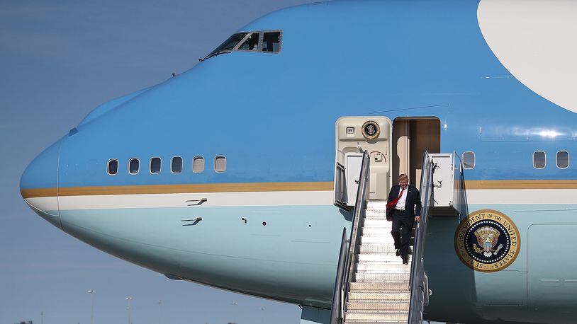 President Donald Trump arrives on Air Force One at the Palm Beach International Airport to spend the weekend at his Mar-a-Lago estate on Feb. 17, 2017.