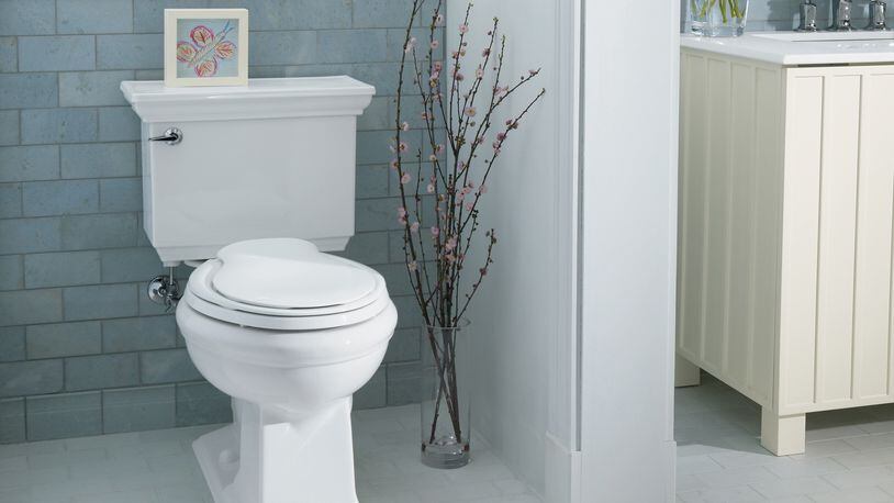 It may be less stressful to carry and work with a two-piece toilet’s smaller components. (Kohler)