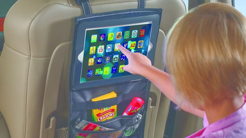 In an undated handout photo, the High Road PadPockets tablet holder and car seat organizer. The $30 accessory, which puts more of the seat back space to use, is one of a number of items that could shift a ho-hum holiday road trip into the next gear. (Handout via The New York Times)