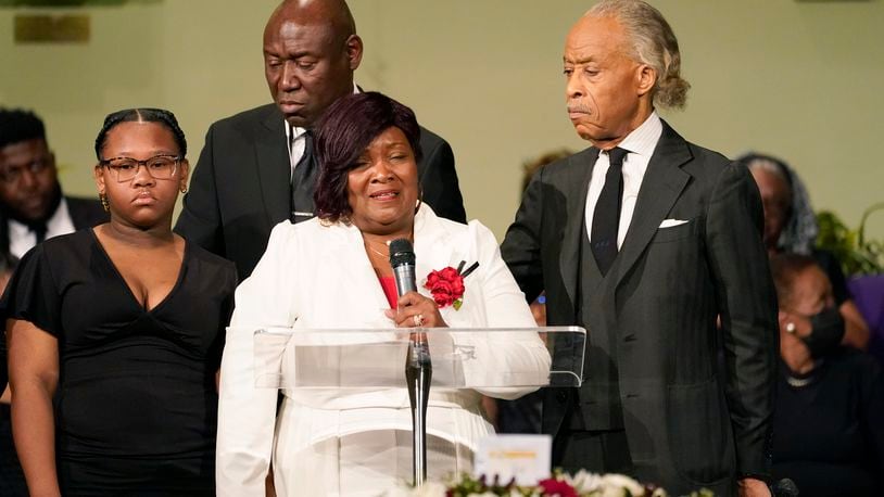 FILE -Bettersten Wade speaks to the attendees of her son Dexter Wade's funeral service in Jackson, Miss. Monday, Nov. 20, 2023. Looking on are the Rev. Al Sharpton, right, who delivered the eulogy, civil rights attorney Ben Crump, background, and one of her son's daughters, Jaselyn Thomas. Bettersten Wade, a woman who sued Mississippi's capital city over the death of her brother has decided to reject a settlement after officials publicly disclosed how much the city would pay his survivors, her attorney said Wednesday. (AP Photo/Rogelio V. Solis, File)