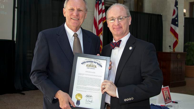 Mike Jackson (left) of Tipp City is recognized by State Sen. Bill Beagle of Tipp City at the May 19 Ohio Senior Citizens Hall of Fame induction at the Ohio Statehouse. CONTRIBUTED