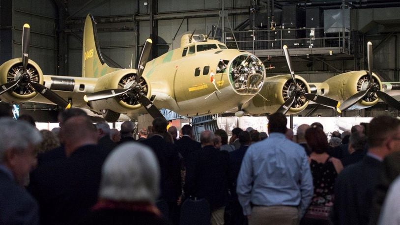 Crowds gather around the B-17F Memphis Belle to get a better look at the conclusion of its unveiling ceremony at the Memphis Belle exhibit inside the National Museum of the U.S. Air Force, Wright-Patterson Air Force Base, May 16. The Memphis Belle is the most famous Flying Fortress, having been the first able to return to the United States following 25 combat missions over occupied Europe during World War II. (U.S. Air Force photo/Wesley Farnsworth)