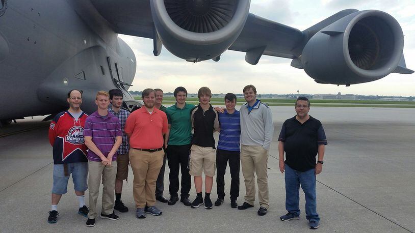 Members of the Wright State University Hockey Team and their assistant athletic director stand in front of the C-17 they had just boarded on the first leg of their team-building tour of Wright-Patterson Air Force Base Sept. 6. (U.S. Air Force photos/W. Eugene Barnett)