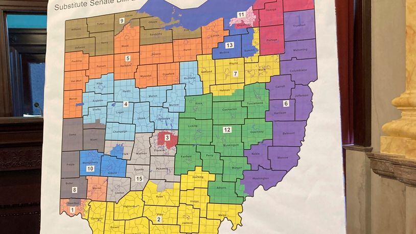 FILE — One of the new map of Ohio congressional districts sits on display during a committee hearing in this file photo from, Nov. 16, 2021, at the Ohio Statehouse in Columbus, Ohio. Accusations have flown for months over whose delays are most to blame for Ohio's redistricting predicament, a mess of a political mapmaking fight that's left the state with unsettled political boundaries and no date for its Statehouse primaries. (AP Photo/Julie Carr Smyth)